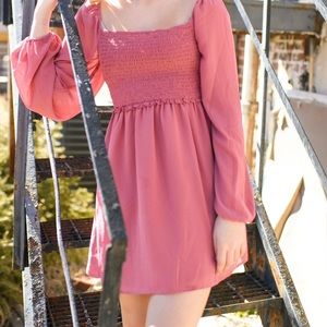 Pink long-sleeved baby doll dress
